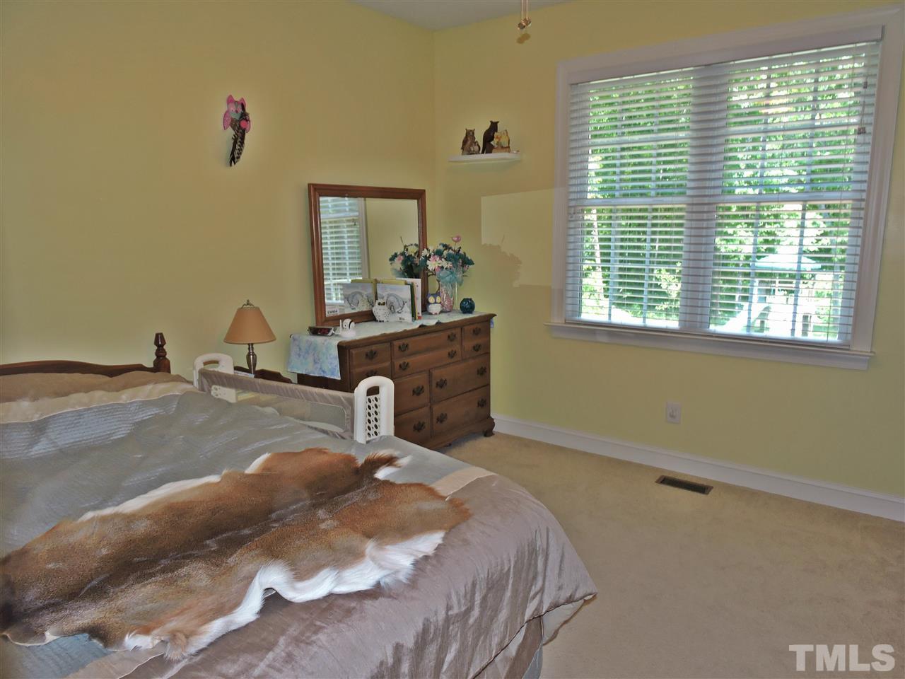 174 Weaver Ridge Road Rougemont, NC 27572 - Photo 19 of 25 a room with a bed and a window