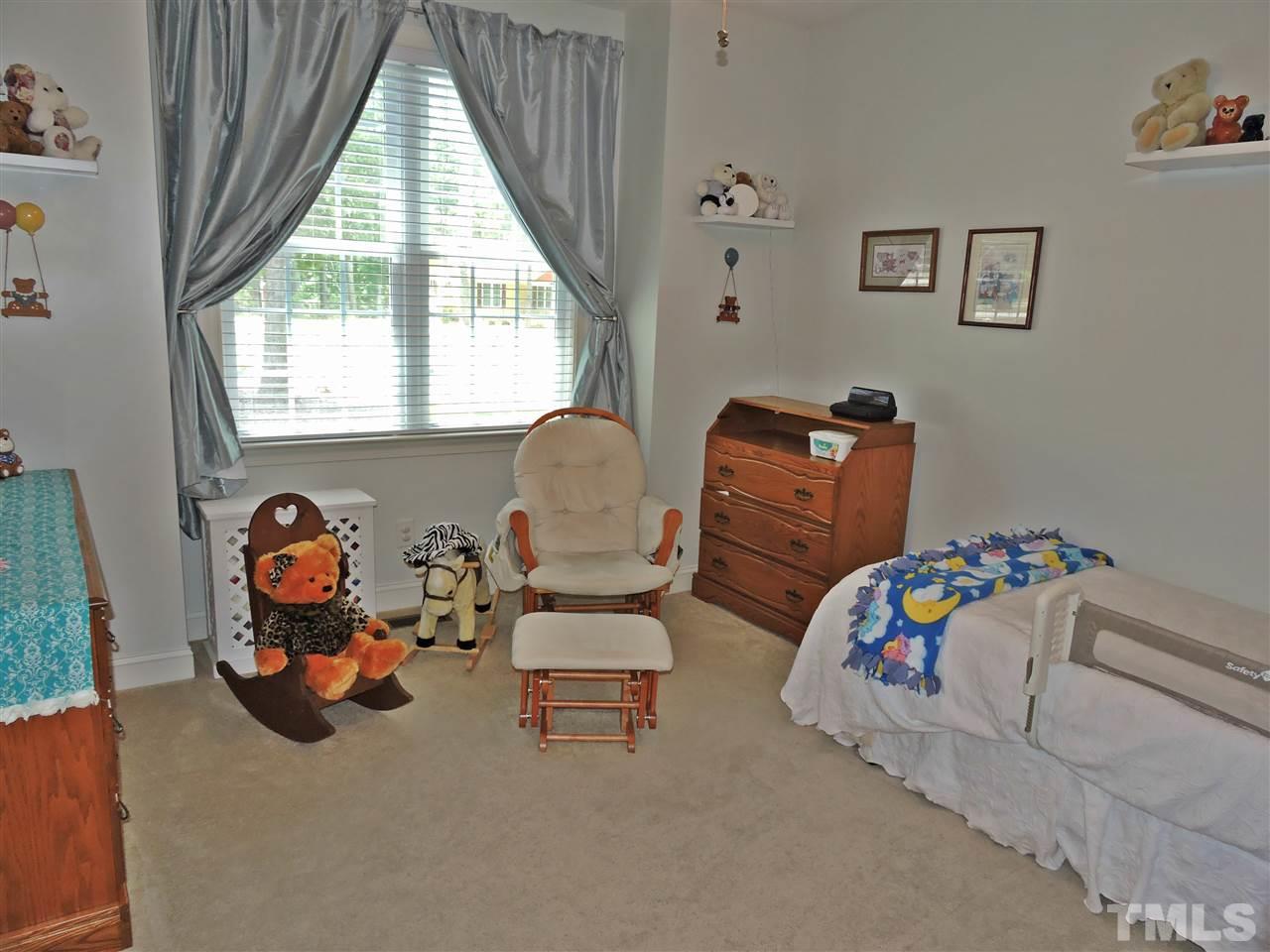 174 Weaver Ridge Road Rougemont, NC 27572 - Photo 21 of 25 a bedroom with bed and a couch