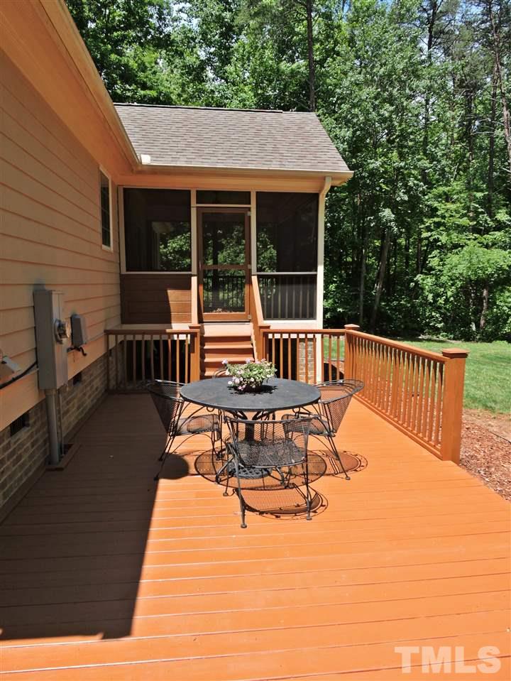 174 Weaver Ridge Road Rougemont, NC 27572 - Photo 22 of 25 a view of a patio with table and chairs and potted plants