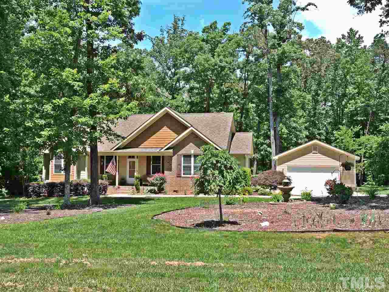 174 Weaver Ridge Road Rougemont, NC 27572 - Photo 23 of 25 a front view of a house with a yard and trees