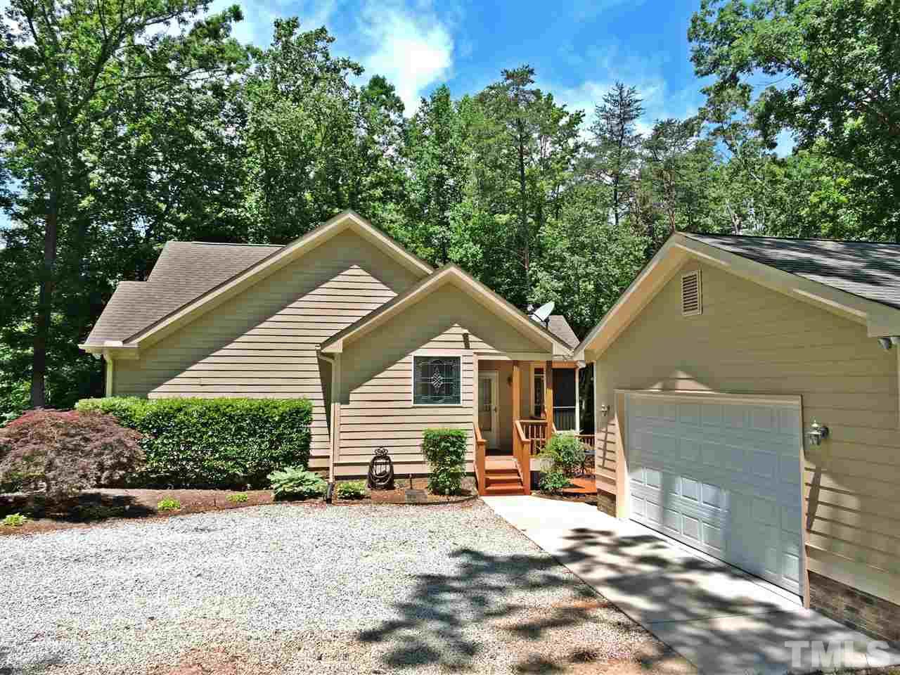 174 Weaver Ridge Road Rougemont, NC 27572 - Photo 24 of 25 a view of a house with a yard and large tree