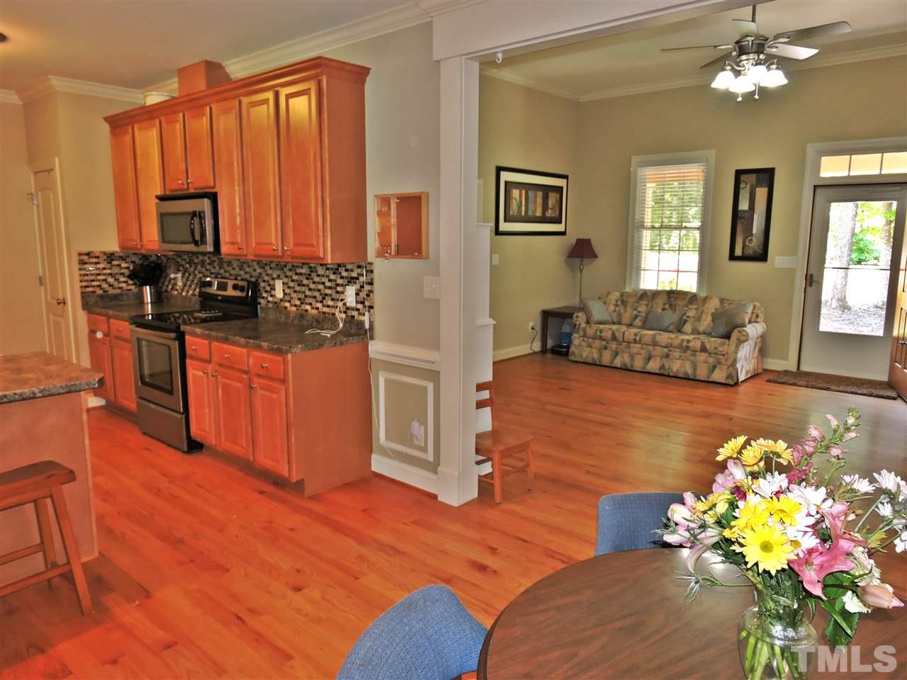 174 Weaver Ridge Road Rougemont, NC 27572 - Photo 4 of 25 a living room with furniture potted plant and wooden floor