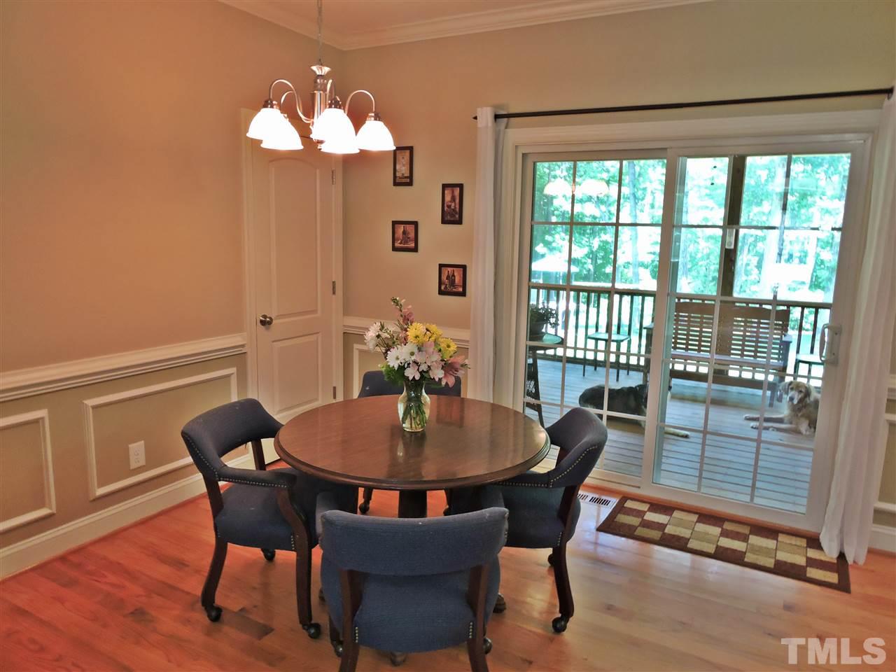 174 Weaver Ridge Road Rougemont, NC 27572 - Photo 6 of 25 a dining room with furniture a potted plant and wooden floor