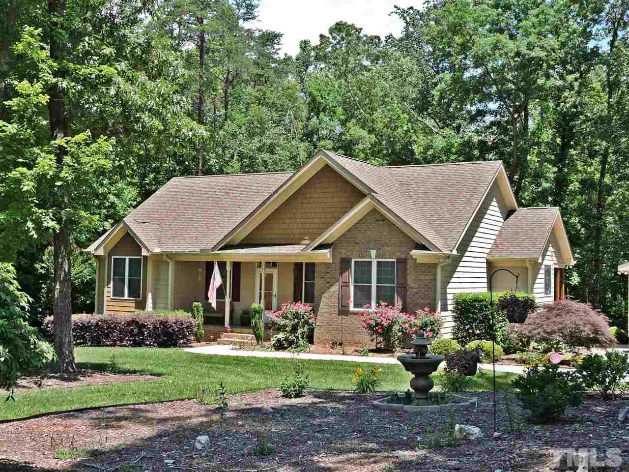 174 Weaver Ridge Road Rougemont, NC 27572 - Photo 9 of 25 a front view of a house with garden