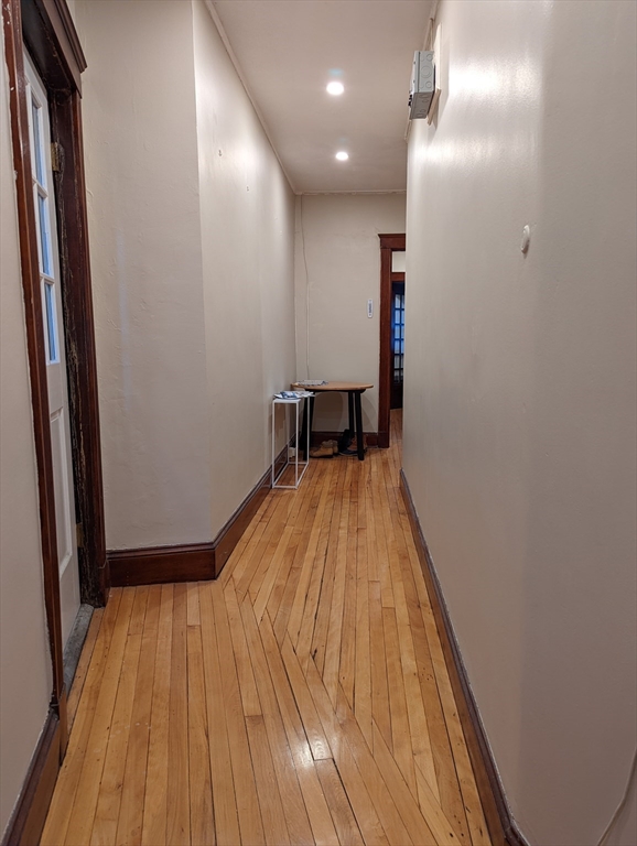 174 Winthrop Road, Unit 2 Brookline, MA 02445 - Photo 4 of 9 a view of a room with wooden floor and a balcony