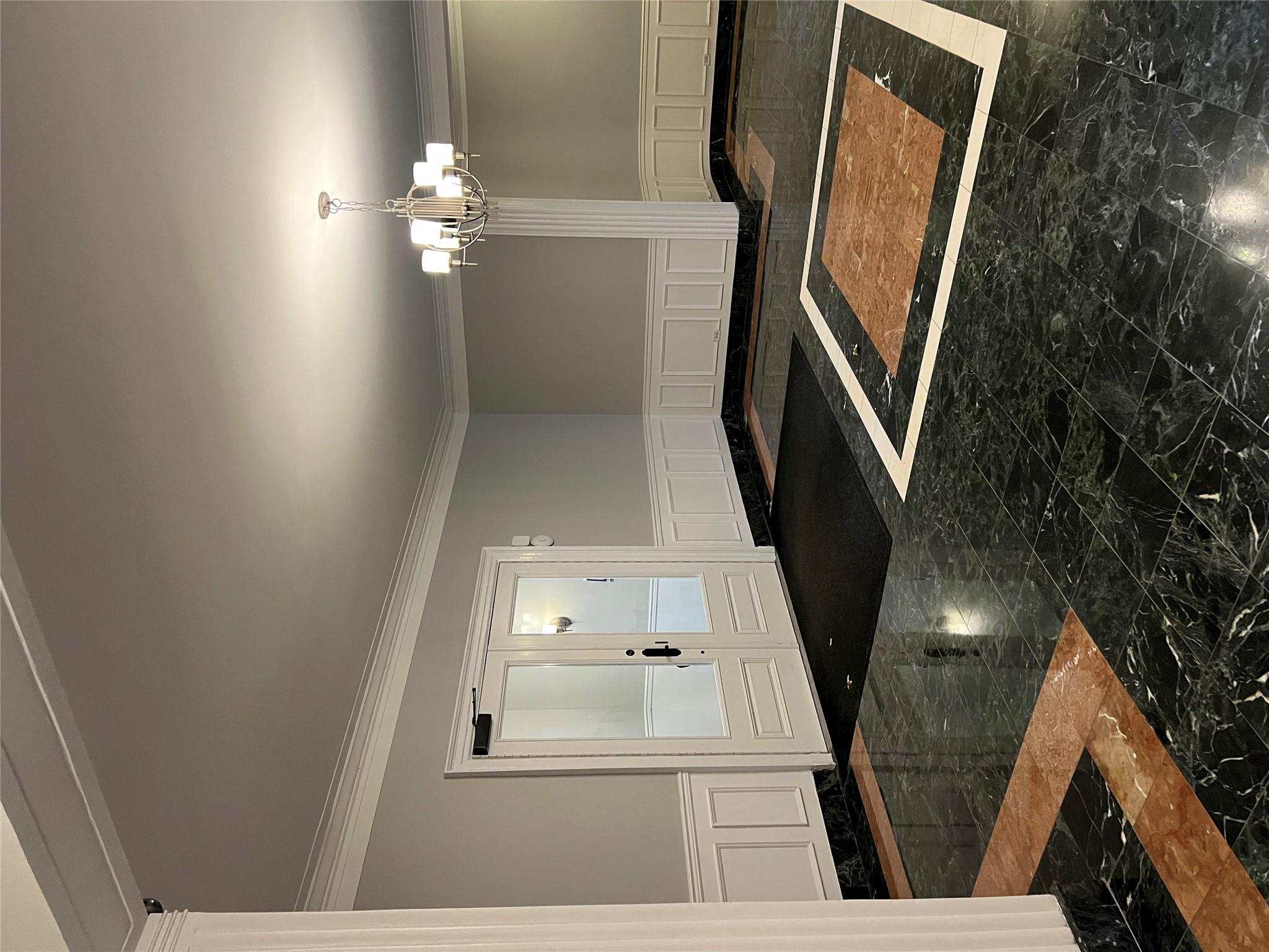 35-35 75th Street, Unit 127 Queens, NY 11372 - Photo 14 of 50 Entryway featuring crown molding and a chandelier