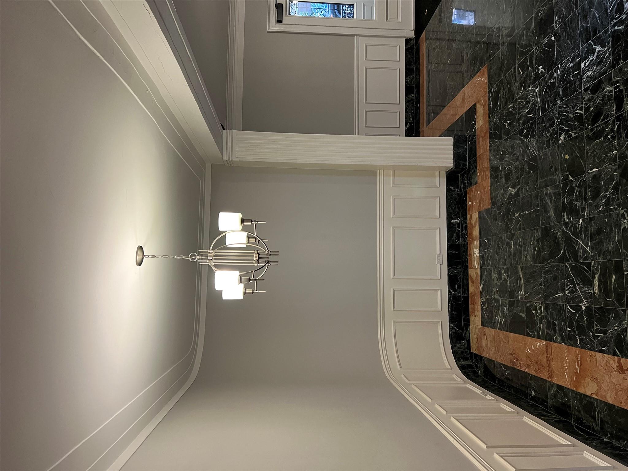 35-35 75th Street, Unit 127 Queens, NY 11372 - Photo 38 of 50 Unfurnished dining area with a notable chandelier and ornamental molding