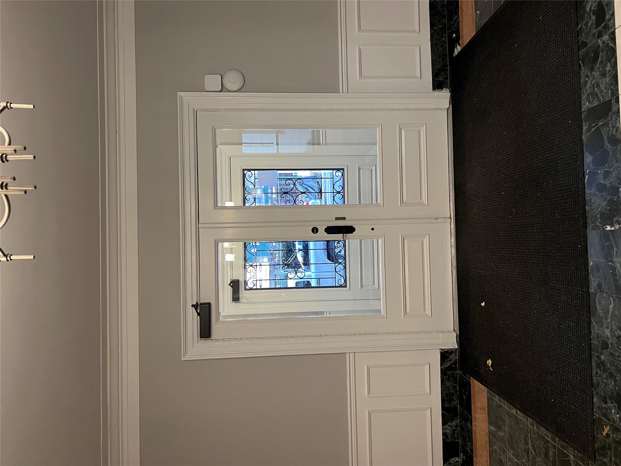 35-35 75th Street, Unit 127 Queens, NY 11372 - Photo 40 of 50 Doorway to outside with french doors and ornamental molding