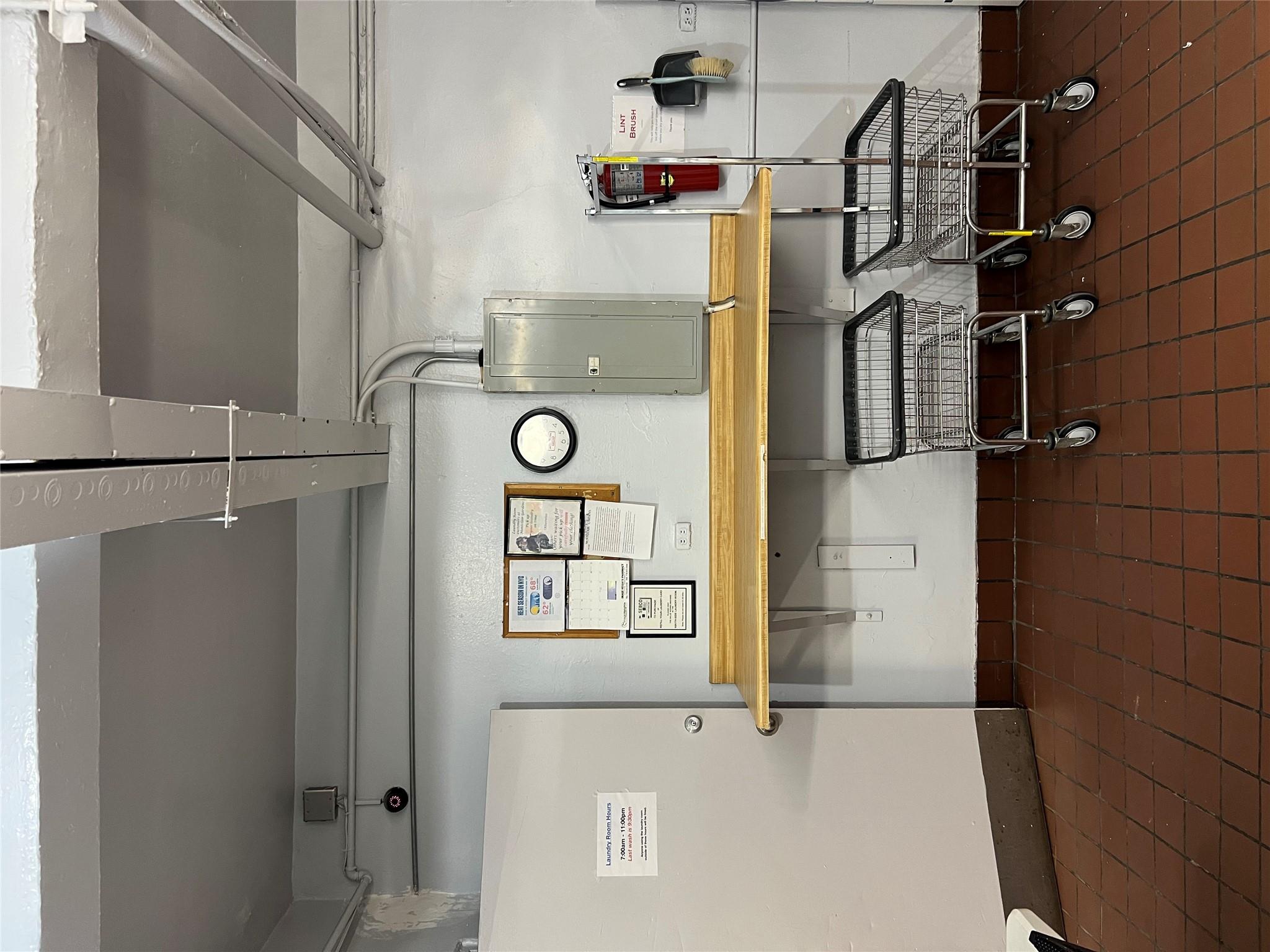 35-35 75th Street, Unit 127 Queens, NY 11372 - Photo 44 of 50 Basement featuring electric panel and dark tile patterned floors