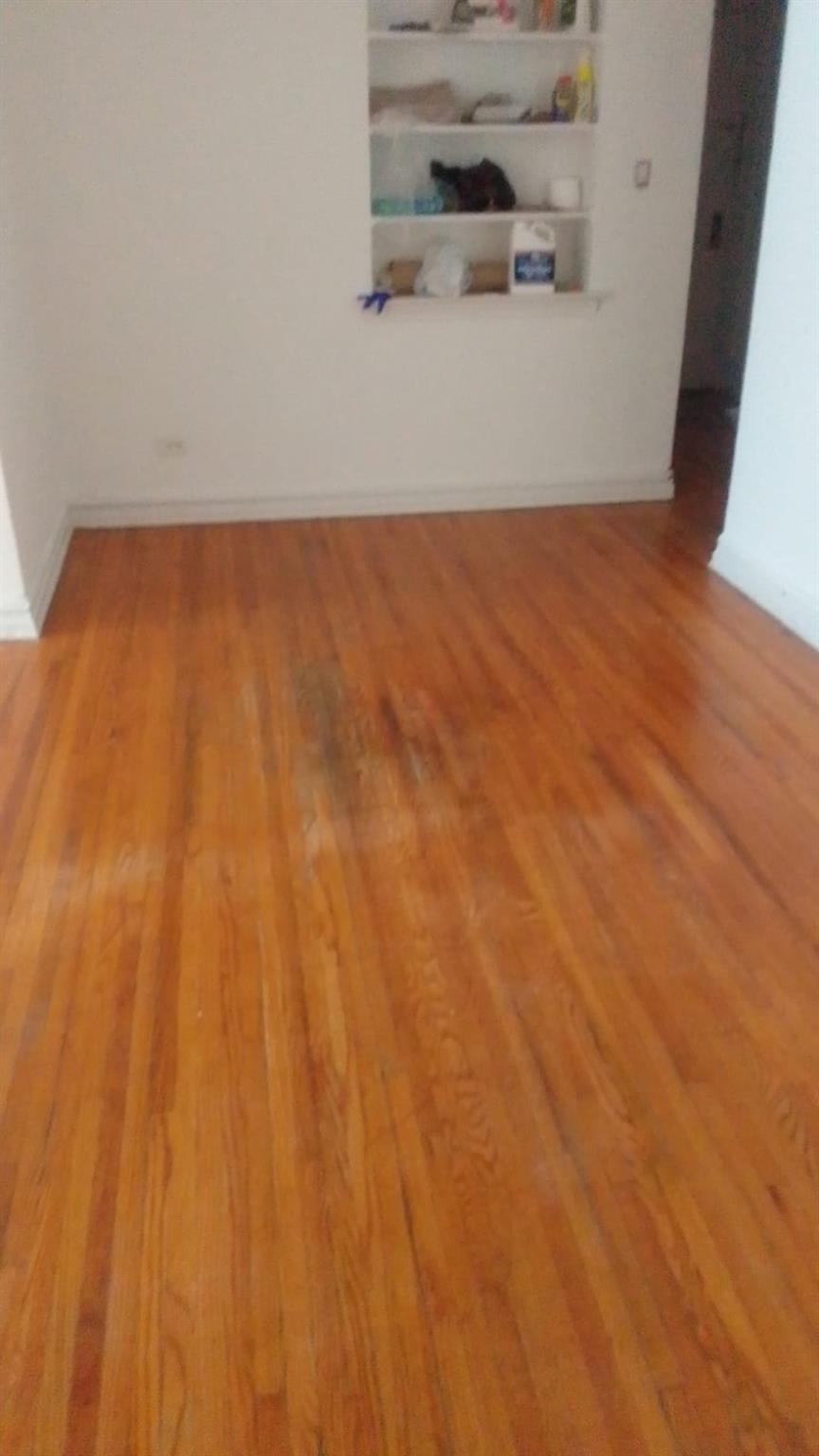 35-35 75th Street, Unit 127 Queens, NY 11372 - Photo 49 of 50 Unfurnished room with wood finished floors and baseboards