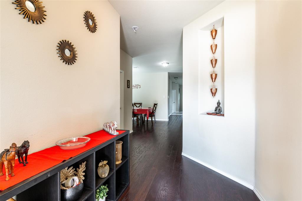 504 Rocky Pine Road McKinney, TX 75072 - Photo 8 of 36 Corridor featuring dark wood-type flooring and baseboards