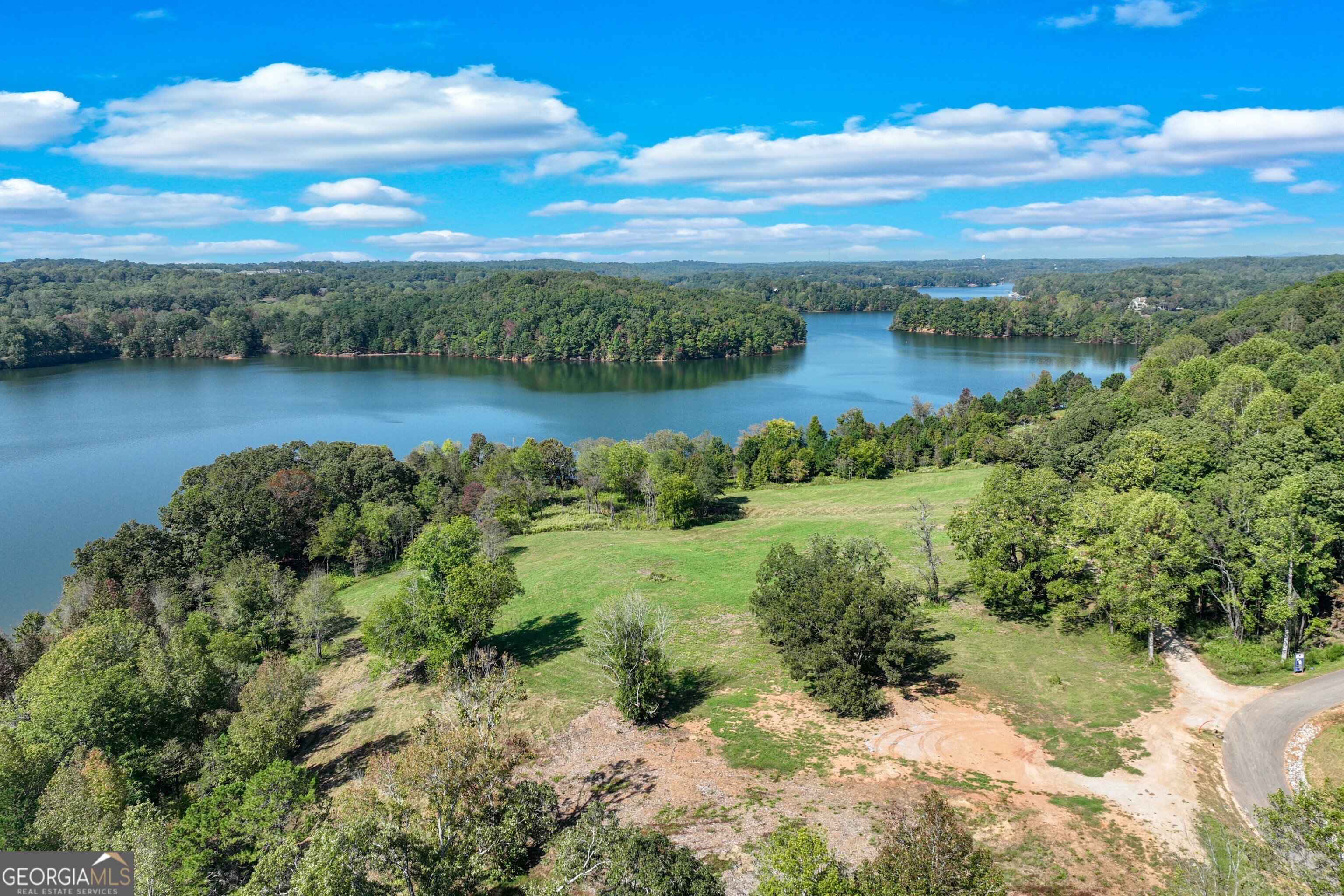 4540 Shirley Road, Unit LOT 15 Gainesville, GA 30506 - Photo 10 of 22 a view of a lake with houses in the back
