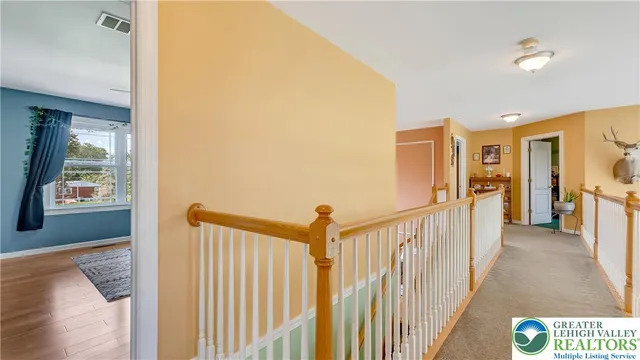a bathroom with a large tub sink and vanity