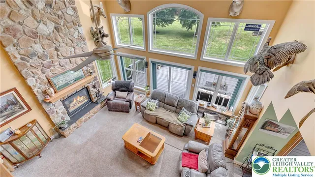 a bedroom with furniture and a flat screen tv