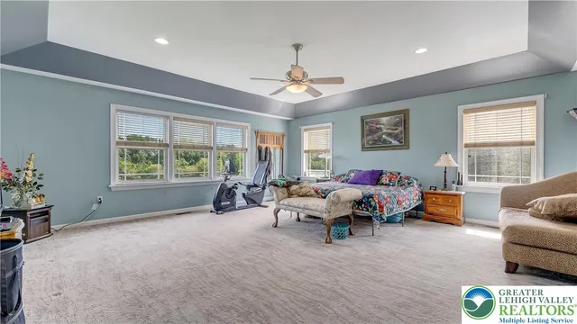 an aerial view of a house with garden space and street view