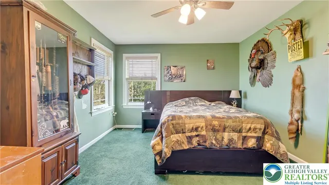 a aerial view of a house with a yard table and chairs