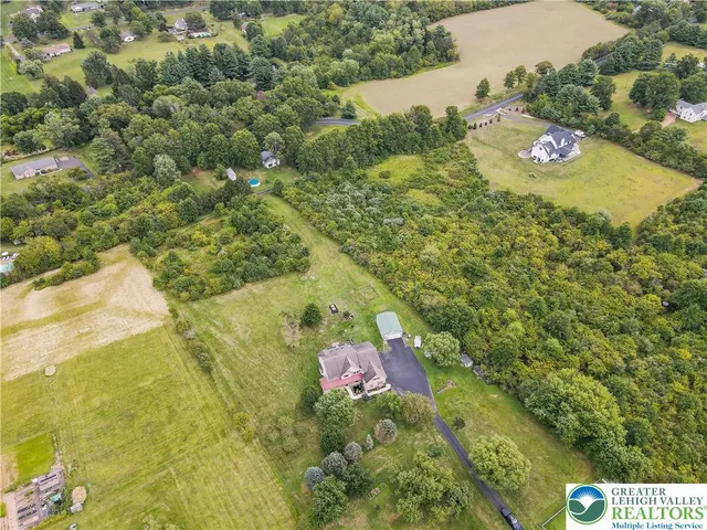 swimming pool view with a seating space