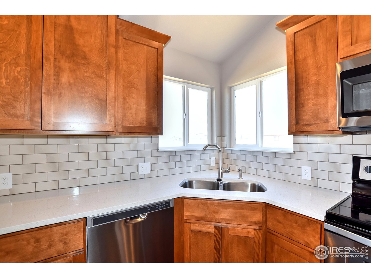 637 Rock Road Eaton, CO 80615 - Photo 12 of 32 Stunning subway tile and window over sink area