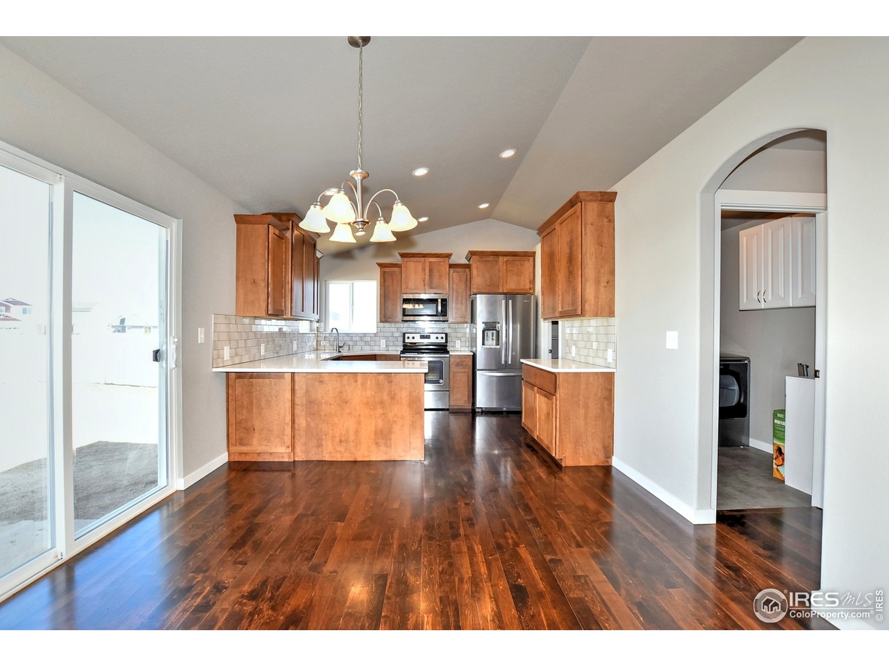 637 Rock Road Eaton, CO 80615 - Photo 8 of 32 Sliding doors off of kitchen to backyard