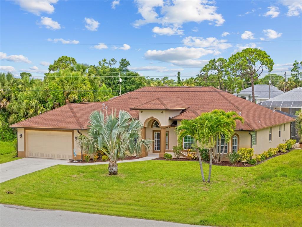 37 Marker Road Rotonda West, FL 33947 - Photo 1 of 1 a house with garden in front of it