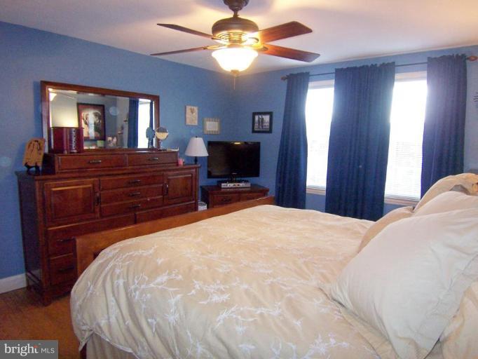 331 Stratford Road Catonsville, MD 21228 - Photo 14 of 30 a bedroom with a bed and a chandelier
