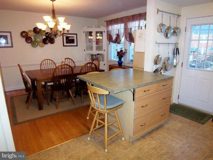 331 Stratford Road Catonsville, MD 21228 - Photo 23 of 30 a view of a dining room with furniture and chandelier