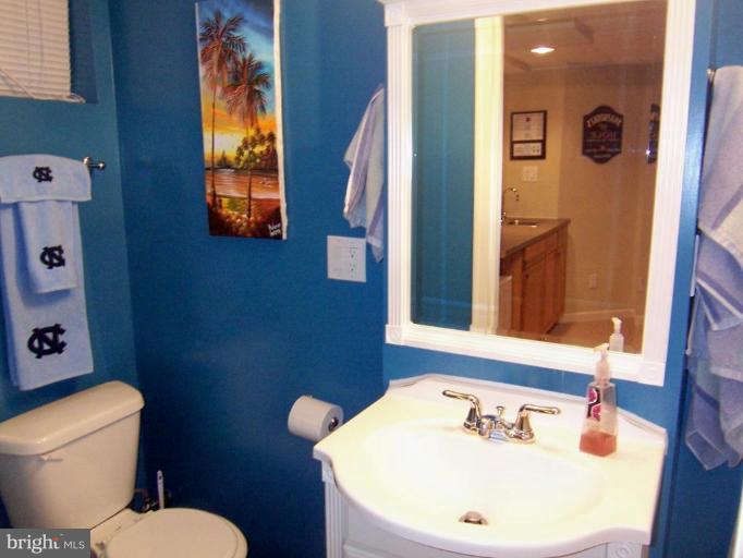 331 Stratford Road Catonsville, MD 21228 - Photo 4 of 30 a bathroom with a sink and a mirror