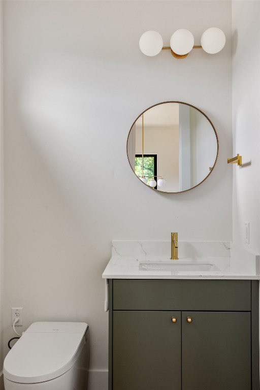 505 Philco Drive, Unit 3 Austin, TX 78745 - Photo 12 of 36 a bathroom with a sink a mirror and a toilet