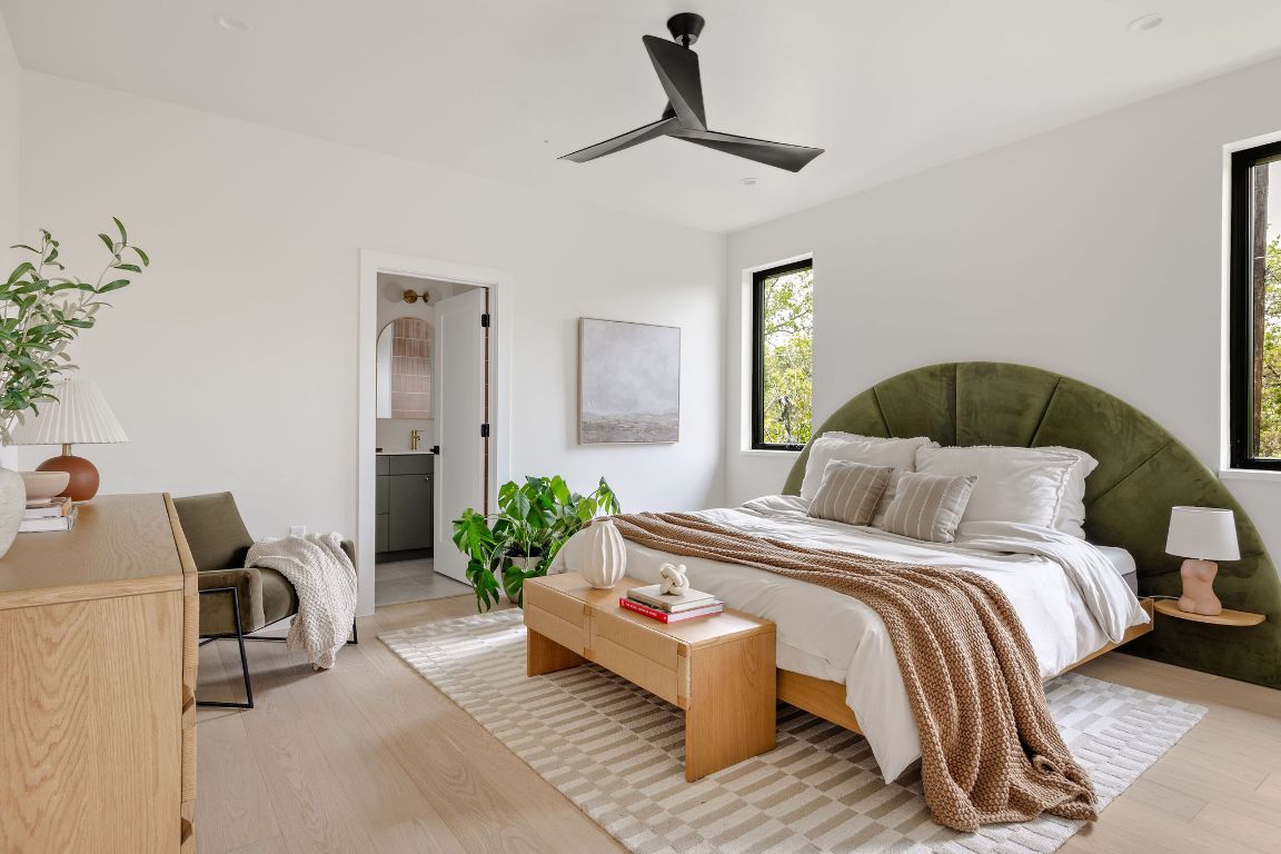 505 Philco Drive, Unit 3 Austin, TX 78745 - Photo 13 of 36 a bedroom with a bed couch and a window