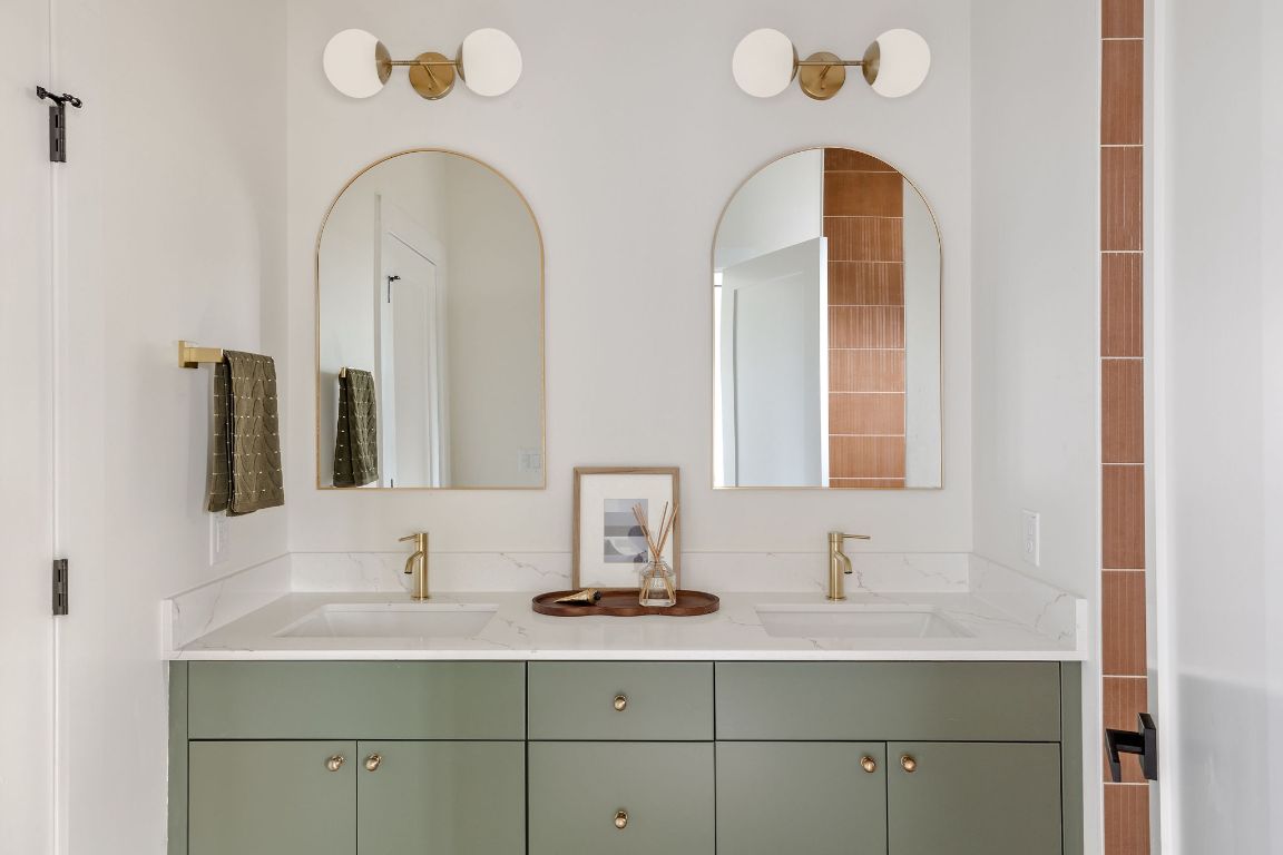 505 Philco Drive, Unit 3 Austin, TX 78745 - Photo 15 of 36 a bathroom with a double vanity sink and mirror
