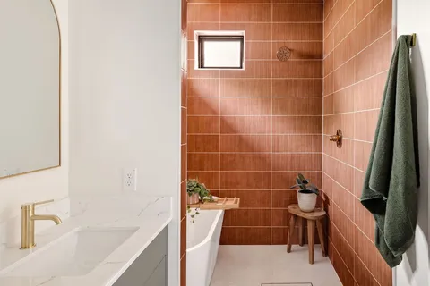 a bathroom with a double vanity sink and mirror