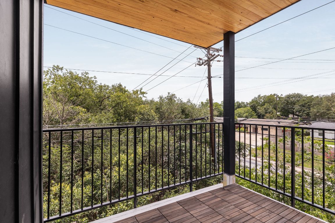 505 Philco Drive, Unit 3 Austin, TX 78745 - Photo 21 of 36 a view of a balcony with wooden floor