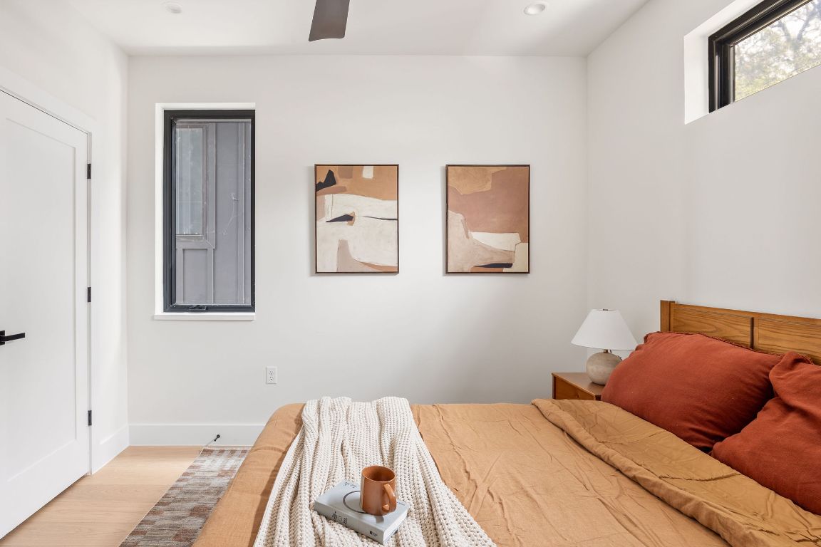 505 Philco Drive, Unit 3 Austin, TX 78745 - Photo 23 of 36 a bedroom with a bed and painting on the wall