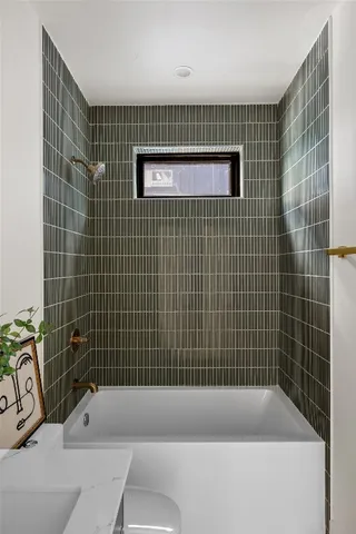 a bathroom with a sink a mirror and a shower