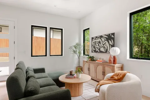 a living room with furniture and window
