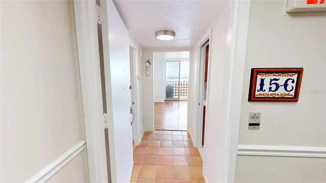 a view of a hallway with paintings on the wall
