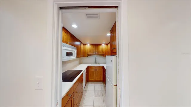 a view of walk in closet with living room