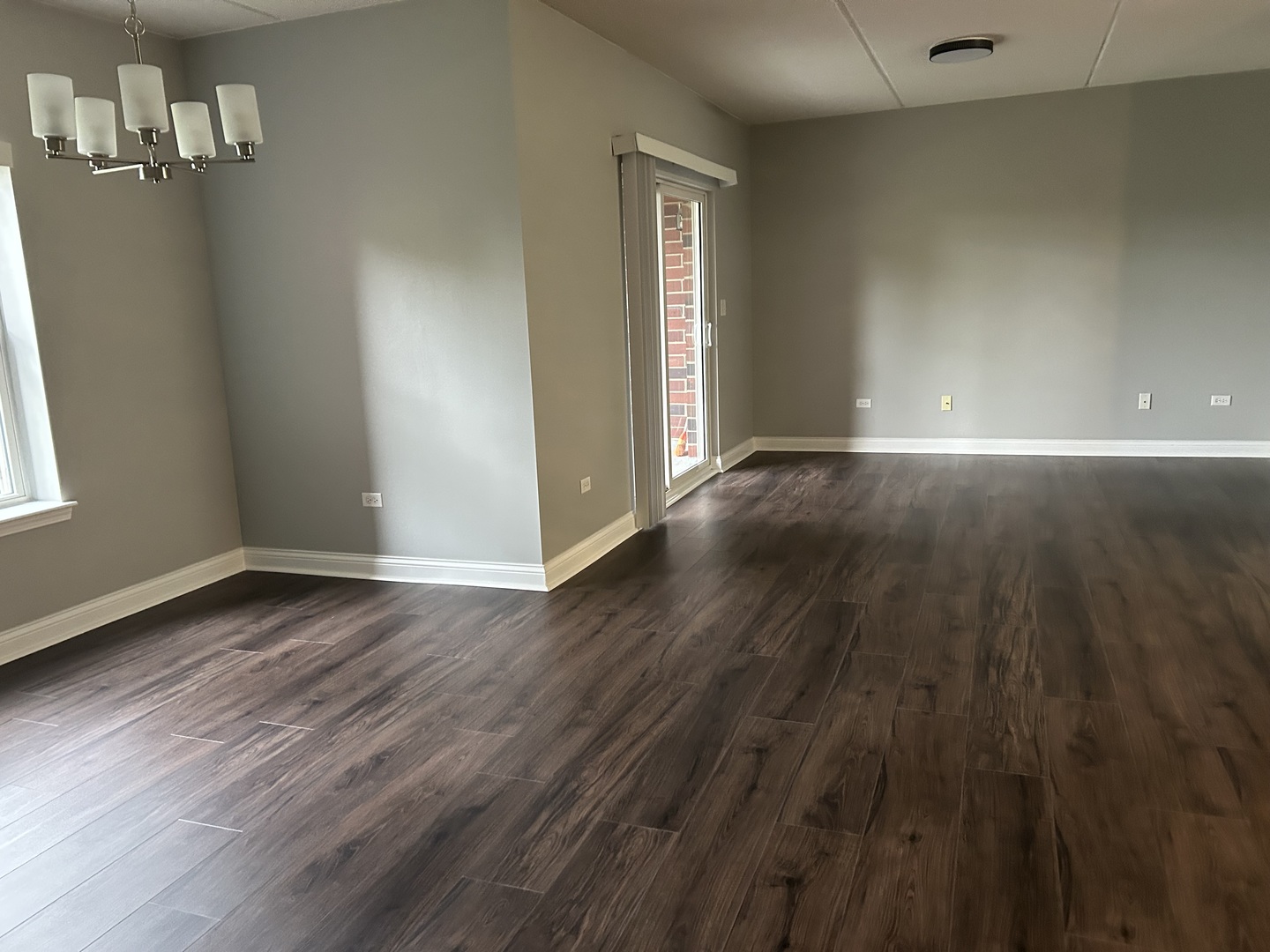 3400 North Old Arlington Heights Road, Unit 306 Arlington Heights, IL 60004 - Photo 4 of 10 an empty room with wooden floor and windows