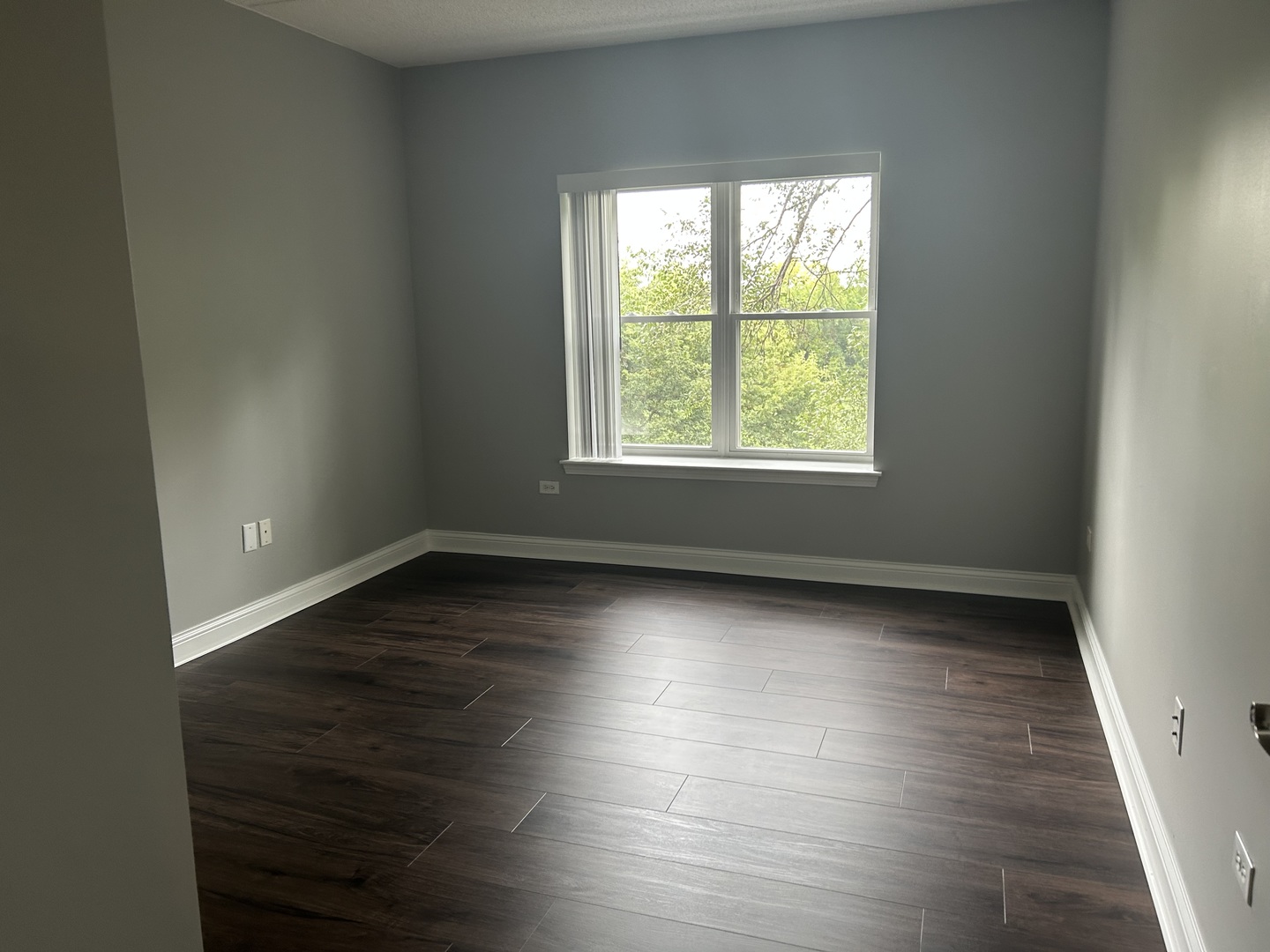 3400 North Old Arlington Heights Road, Unit 306 Arlington Heights, IL 60004 - Photo 6 of 10 an empty room with wooden floor and windows