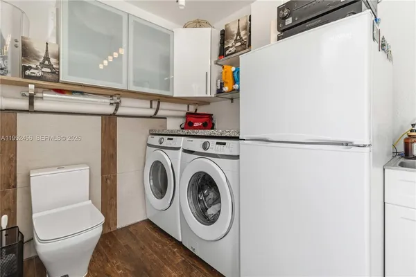 a utility room with dryer and washer
