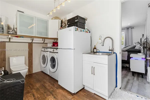 a utility room with dryer and washer