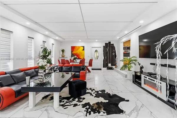 a living room with furniture and a flat screen tv