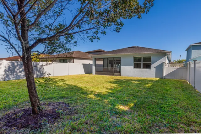a sign on the side of a tree