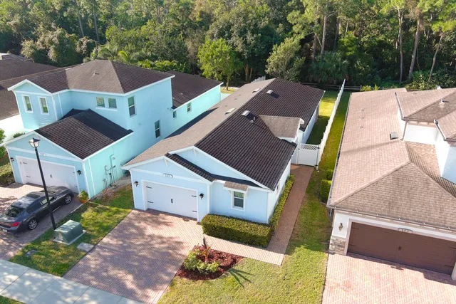 an aerial view of a house with a garden