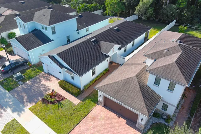 an aerial view of house with yard swimming pool and outdoor seating