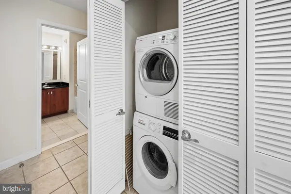 a view of a kitchen with washer and dryer