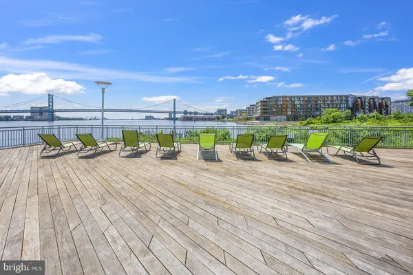 a view of house with deck outdoor space and seating area