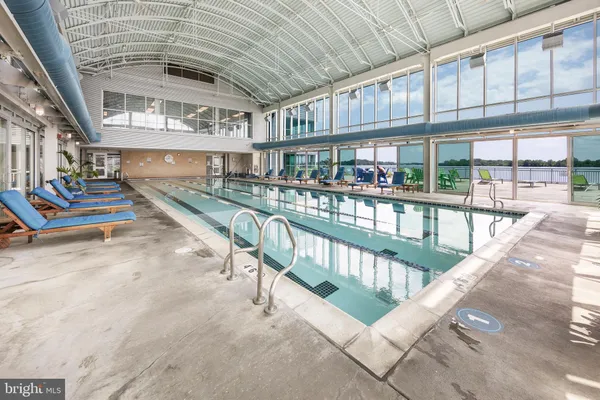 a view of a swimming pool with outdoor seating