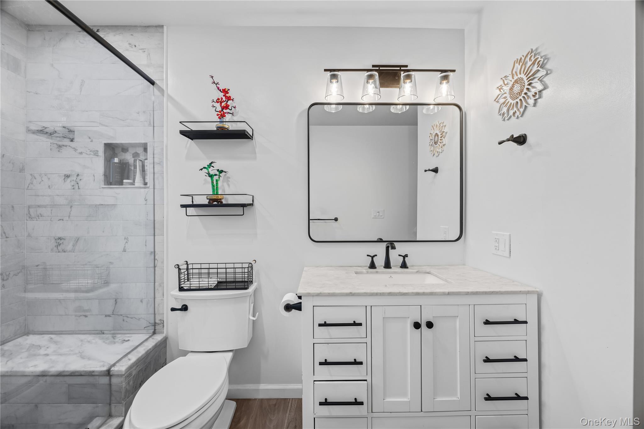 69 Silver Spring Road New Windsor, NY 12553 - Photo 11 of 20 a bathroom with a sink toilet and shower