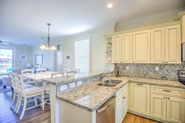 a kitchen with a sink stove and cabinets